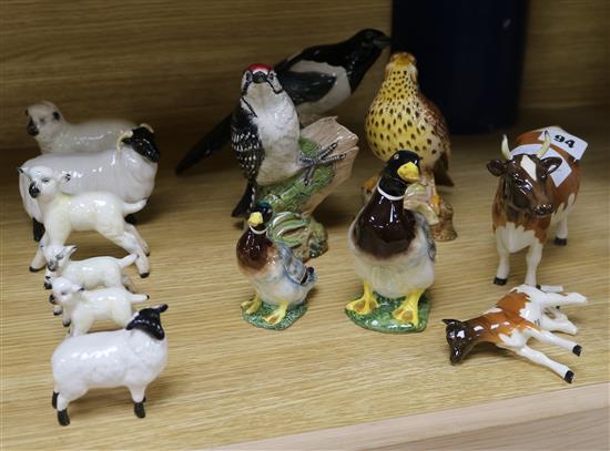 A collection of Beswick sheep, cows, ducks and birds